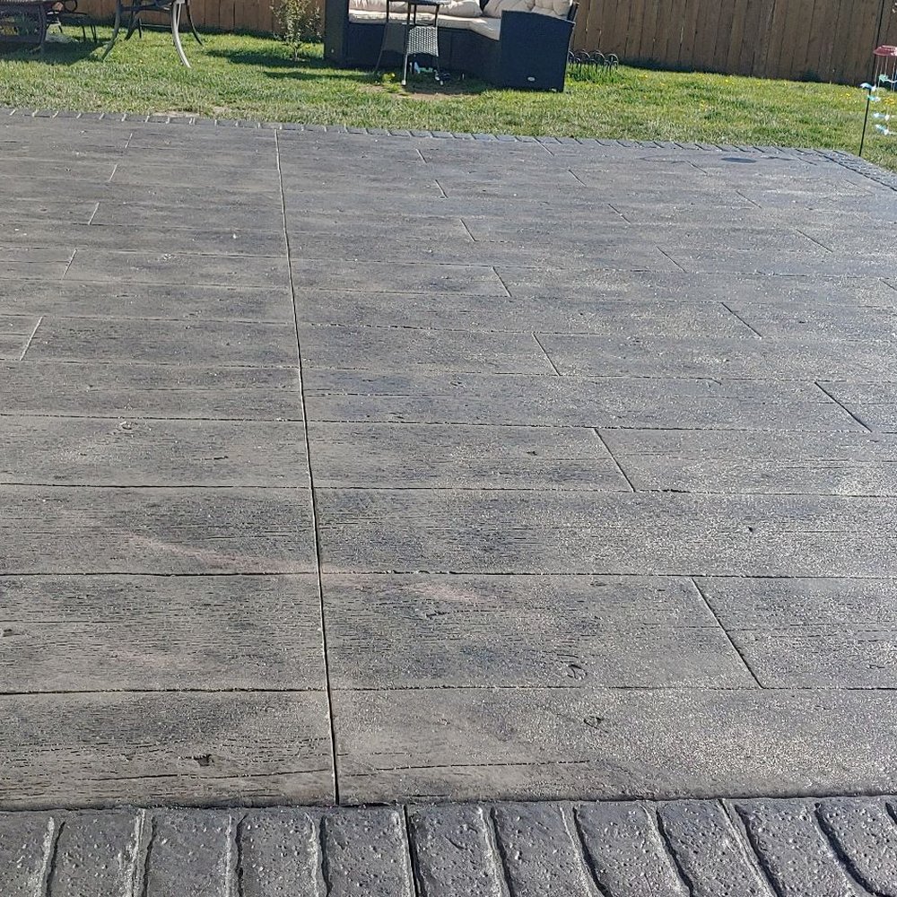 De Hoyos Concrete - The beautiful pattern in the middle is wood grain stamped with a light gray color. The border is brick with a charcoal gray color. - Masonry/Concrete Near Me - Beach Park, Illinois De Hoyos Concrete - The beautiful pattern in the middle is wood grain stamped with a light gray color. The border is brick with a charcoal gray color. - Masonry/Concrete Near Me - Beach Park, Illinois