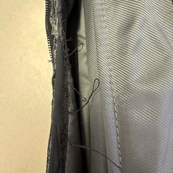 Alamo Shoe Repair - They hand stitched the zipper and made an ugly mess.