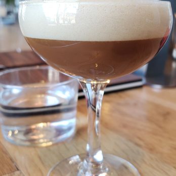 Analog Coffee Bar - a glass of coffee on a wooden table - Coffee & Tea Near Me - Newport, Kentucky Analog Coffee Bar - a glass of coffee on a wooden table - Coffee & Tea Near Me - Newport, Kentucky