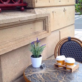Banquerie - Takeaway cappuccinos on one of their outdoor tables. - Coffee & Tea Near Me - Pyrmont, NSW