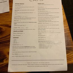 a menu on a wooden table a menu on a wooden table
