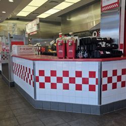 Five Guys - Order and pick up area with condiments on the side