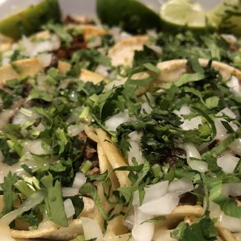 Tacos la Banqueta - a close up of a plate of food - Mexican Near Me - Dallas, Texas