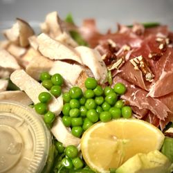 Chicken, Prosciutto & Avocado Salad with organic greens, peas, lemon, pine nuts and dijon vinaigrette.