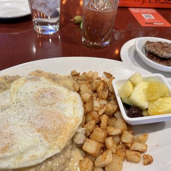 Daily Dose Old Town Bar & Grill - Biscuits and Gravy with 3 over easy eggs and a side of pork sausage. - Breakfast & Brunch Near Me - Scottsdale, Arizona