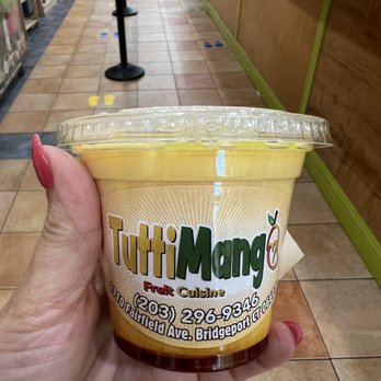 TuttiMango - a person holding a cup of tuttimango - Mexican Near Me - Bridgeport, Connecticut TuttiMango - a person holding a cup of tuttimango - Mexican Near Me - Bridgeport, Connecticut
