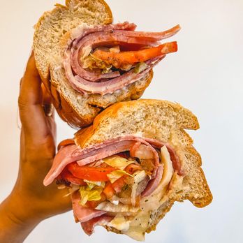 Subbs by Carl - a person holding a sub sandwich - Sandwiches Near Me - Washington, DC, District of Columbia