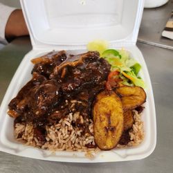 R S Jamaican Restaurant - Beautiful masterpiece of oxtails, veggies, rice and beans, and plantains