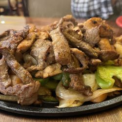 Casa Perez - Beef, chicken, shrimp fajita. Amazing. Came with refried beans and rice (yummy).