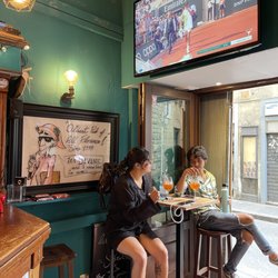 Angie's Pub - Patrons relaxing and watching sports