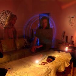 Awaken Oneness - This is photography of the Reiki massage table with medicine wheel hide and Marissa as spirit guides.