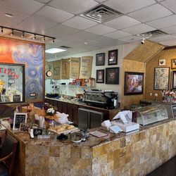 Pastelitos Cafe - Inside counter, fun vibe with art all around.