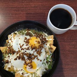 Runny chilaquiles, hard to see the runny part. Runny chilaquiles, hard to see the runny part.