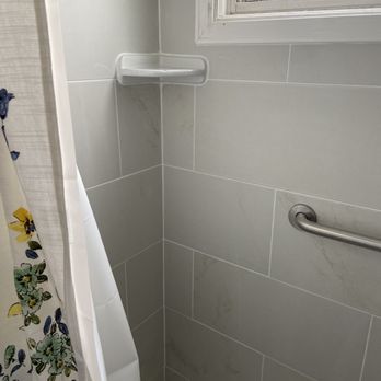 LJ Construction - a shower with a shower curtain - Roofing Near Me - Lancaster, New York