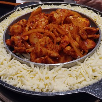 Sikgaek - Cheese dak gal bi. Spicy chicken with mix veg & melted cheese on the side (this is before they turn on the grill) - Korean Near Me - Mississauga, Ontario Sikgaek - Cheese dak gal bi. Spicy chicken with mix veg & melted cheese on the side (this is before they turn on the grill) - Korean Near Me - Mississauga, Ontario