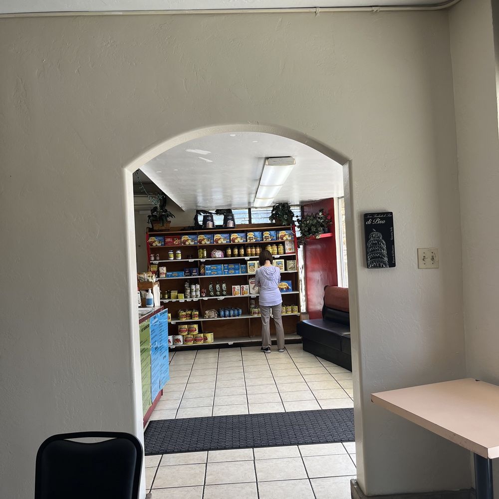 Seating in here and looking out to the mini market and ordering area Seating in here and looking out to the mini market and ordering area