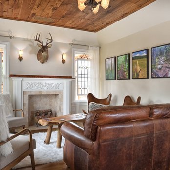 Greymark - a living room with leather furniture - Architects Near Me - Houston, Texas Greymark - a living room with leather furniture - Architects Near Me - Houston, Texas