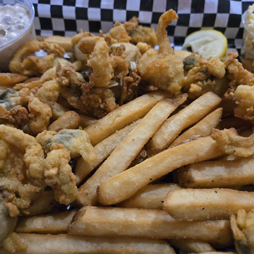 Whole bellied Ipswich clams. Lightly breaded so that clammy deliciousness is there. Hand cut fries and tangy slaw wrap it up Whole bellied Ipswich clams. Lightly breaded so that clammy deliciousness is there. Hand cut fries and tangy slaw wrap it up