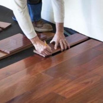LAH Home Improvement and Roofing - a man laying laminate on the floor - Roofing Near Me LAH Home Improvement and Roofing - a man laying laminate on the floor - Roofing Near Me