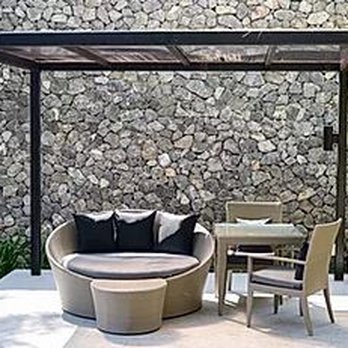 Solid Stucco - a patio with a table and chairs - Stucco Services Near Me - Houston, Texas Solid Stucco - a patio with a table and chairs - Stucco Services Near Me - Houston, Texas