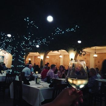 Firefly - The dining room has a tree - Steakhouses Near Me - Panama City Beach, Florida