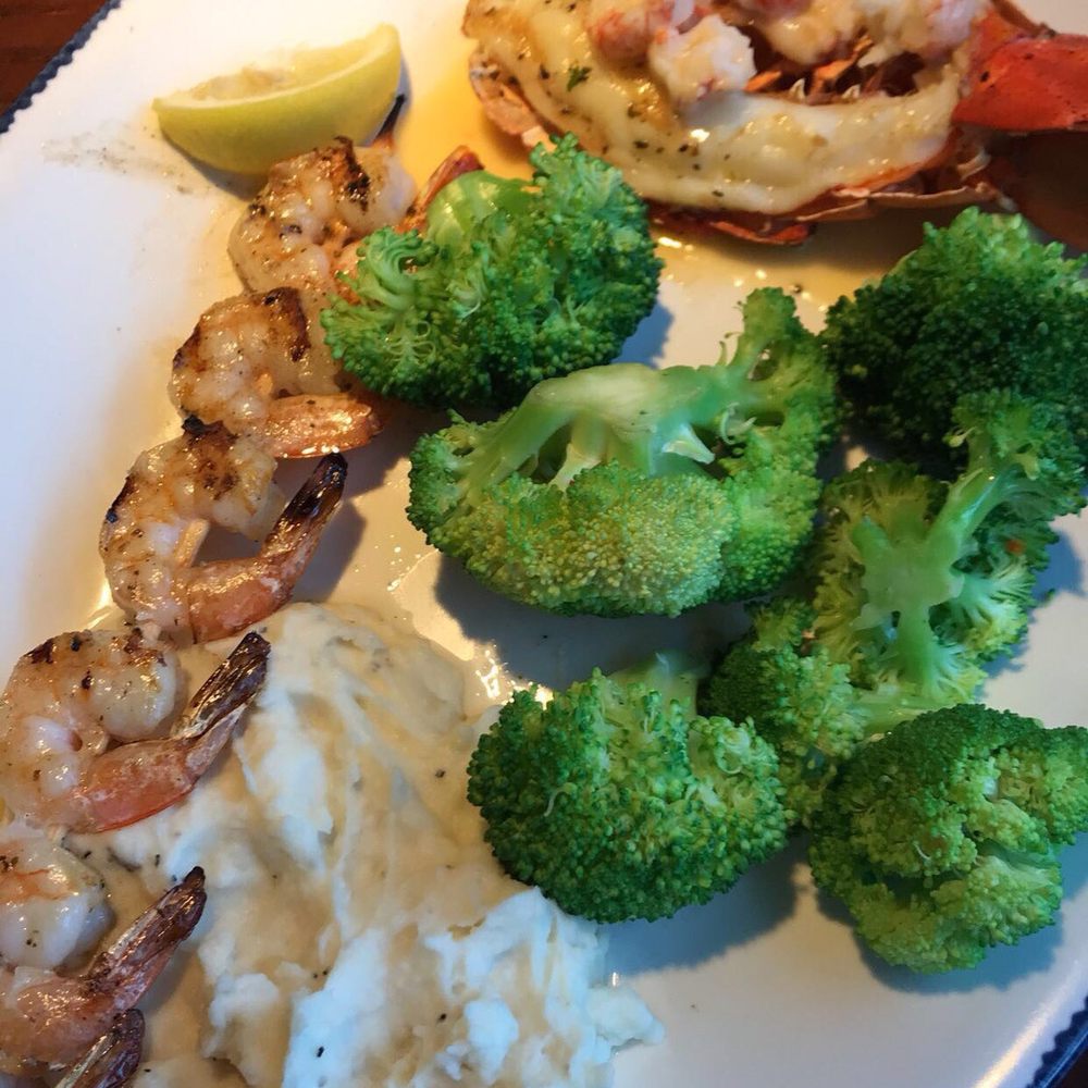 Topped Maine Lobster Tail with Shrimp Wood-Grilled Shrimp Skewers and two sides. Delicious and full of flavor! Topped Maine Lobster Tail with Shrimp Wood-Grilled Shrimp Skewers and two sides. Delicious and full of flavor!