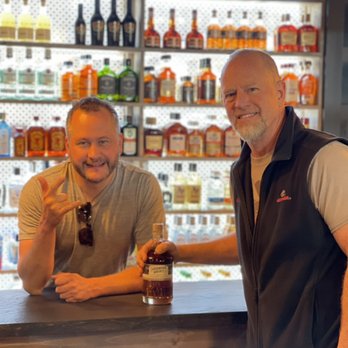 The Tilted Bottle - two men sitting at a bar - Beer, Wine & Spirits Near Me - Hiawassee, Georgia The Tilted Bottle - two men sitting at a bar - Beer, Wine & Spirits Near Me - Hiawassee, Georgia