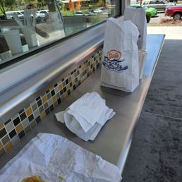 No seating, a small shelf at the end of order counter if you are eating on site
