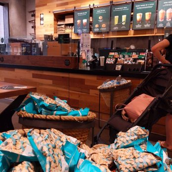 Starbucks - a woman with a stroller in a coffee shop - Coffee & Tea Near Me - Dallas, Texas Starbucks - a woman with a stroller in a coffee shop - Coffee & Tea Near Me - Dallas, Texas