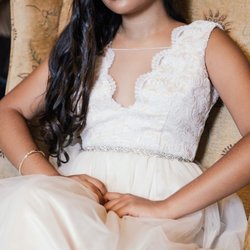 Antoinette's Cleaners & Custom Dressmakers - Beige dress - we had the arm/sleeves areas fixed and the front mesh lowered.