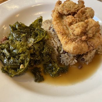 The Kill Devil Grill - A dish from their changing board menu - fried fish and oysters on a bed of rice with braised kale - American Near Me - Kill Devil Hills, North Carolina