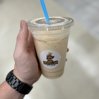 Potelah - a hand holding a cup of iced coffee - Juice Bars & Smoothies Near Me - Parma Heights, Ohio Potelah - a hand holding a cup of iced coffee - Juice Bars & Smoothies Near Me - Parma Heights, Ohio