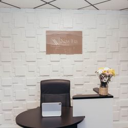 New Era Nails - Our front desk with our certificates and licenses from the department of business and professional regulation. The smells is dream on.