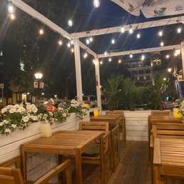 a patio with tables and chairs a patio with tables and chairs