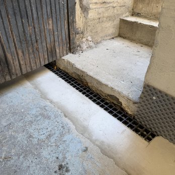B-Dry - Finished work with grate at bulkhead door - Waterproofing Near Me - North Billerica, Massachusetts