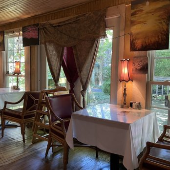 Wildflower Cafe - a dining room with a table and chairs - New American Near Me - Mentone, Alabama Wildflower Cafe - a dining room with a table and chairs - New American Near Me - Mentone, Alabama