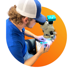 Evo Repairs - Greater Cincinnati Tech Repair - Advanced Microsoldering Tech repairing a damaged Motherboard at Evo Repairs