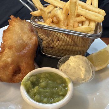 Gus O'Connor's - Fish and chips with mashed peas - Pubs Near Me - Doolin, CE Gus O'Connor's - Fish and chips with mashed peas - Pubs Near Me - Doolin, CE