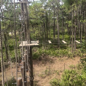 TreeUmph! Adventure Course - The swinging motion makes this challenging. Take your time and it's not so bad. - Ziplining Near Me - Bradenton, Florida TreeUmph! Adventure Course - The swinging motion makes this challenging. Take your time and it's not so bad. - Ziplining Near Me - Bradenton, Florida