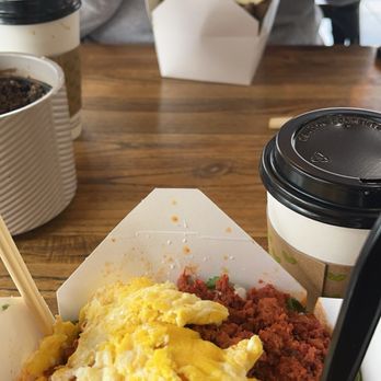LovChCh - Chilaquiles with scrambled eggs and chorizo with chipotle sauce, the other order is red chilaquiles with and over easy egg with asada - Cafes Near Me - Walnut, California