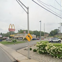 the intersection of a street and a mcdonald's restaurant the intersection of a street and a mcdonald's restaurant