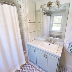 Thom Cincotta Custom Renovation - Updated 1950s bathroom with new custom cabinet, mirror & frame, flower mosaic marble floor tile, and subway tile.  Moen Dartmoor fixtures.