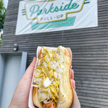 Parkside Pull-Up - a person holding a hot dog - Hot Dogs Near Me - Greensboro, North Carolina