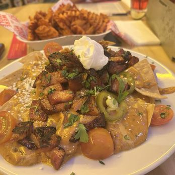 Werewolf - Pork belly nachos and sweet potato waffle fries - Breakfast & Brunch Near Me - San Diego, California Werewolf - Pork belly nachos and sweet potato waffle fries - Breakfast & Brunch Near Me - San Diego, California