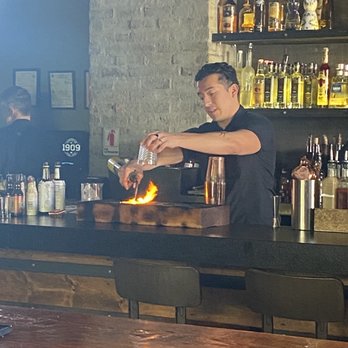 1909 - Bartender doing something with fire. - Bars Near Me - Temecula, California