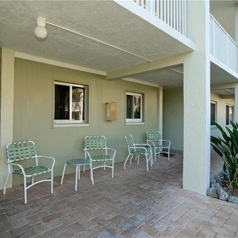 Nautilus Condominiums - poolside entrance, all units have lovely back decks, units on the first floor can have grills - Condominiums Near Me - Holmes Beach, Florida