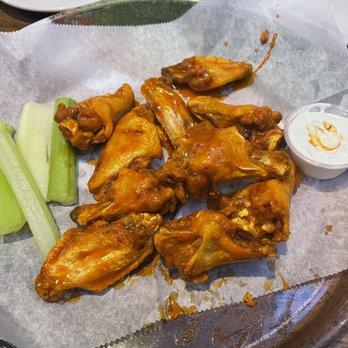 The Pickled Onion Restaurant & Bar - Mild hot wings with celery and blue cheese. - Sports Bars Near Me - Raleigh, North Carolina The Pickled Onion Restaurant & Bar - Mild hot wings with celery and blue cheese. - Sports Bars Near Me - Raleigh, North Carolina