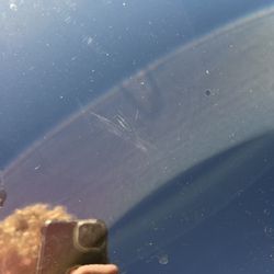 Zips Car Wash - One of multiple scratches on the car. This was left on the hood.