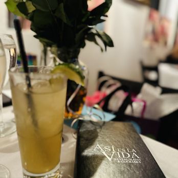 Asi Es La Vida - a glass of lemonade and a book on a table - Mexican Near Me - Phoenix, Arizona