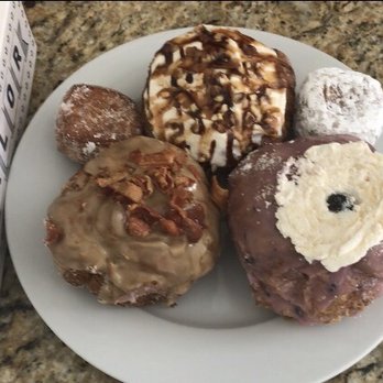 Parlor Doughnuts - Maple Bacon doughnut, mini Cinnamon Sugar Mini, Turtle Cheesecake, Raspberry Jelly Filled Mini, and Blueberry Hill - Donuts Near Me - Aurora, Colorado